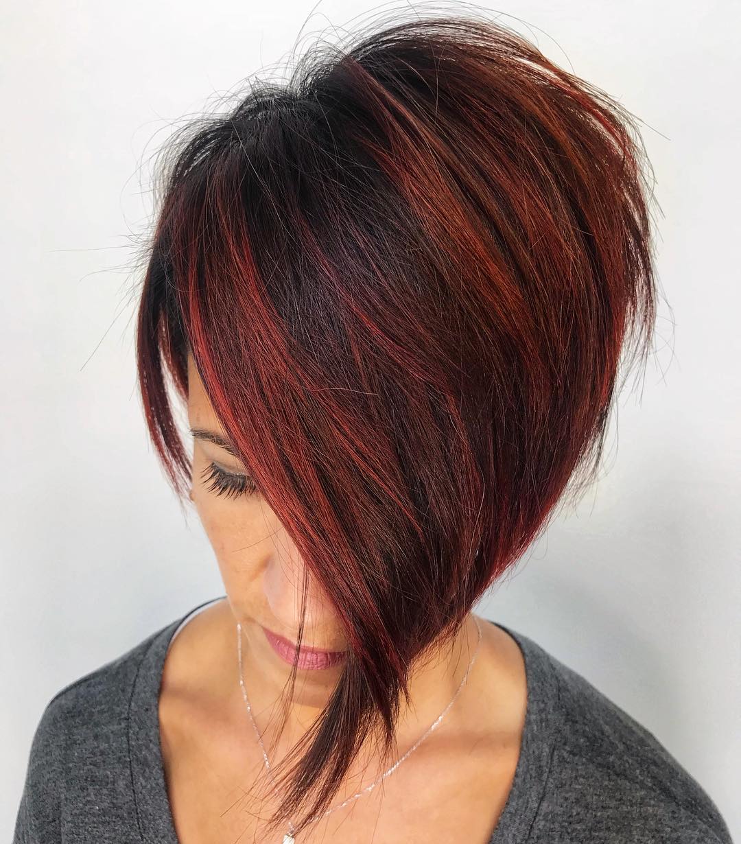 Short Asymmetrical Cut With Red Balayage