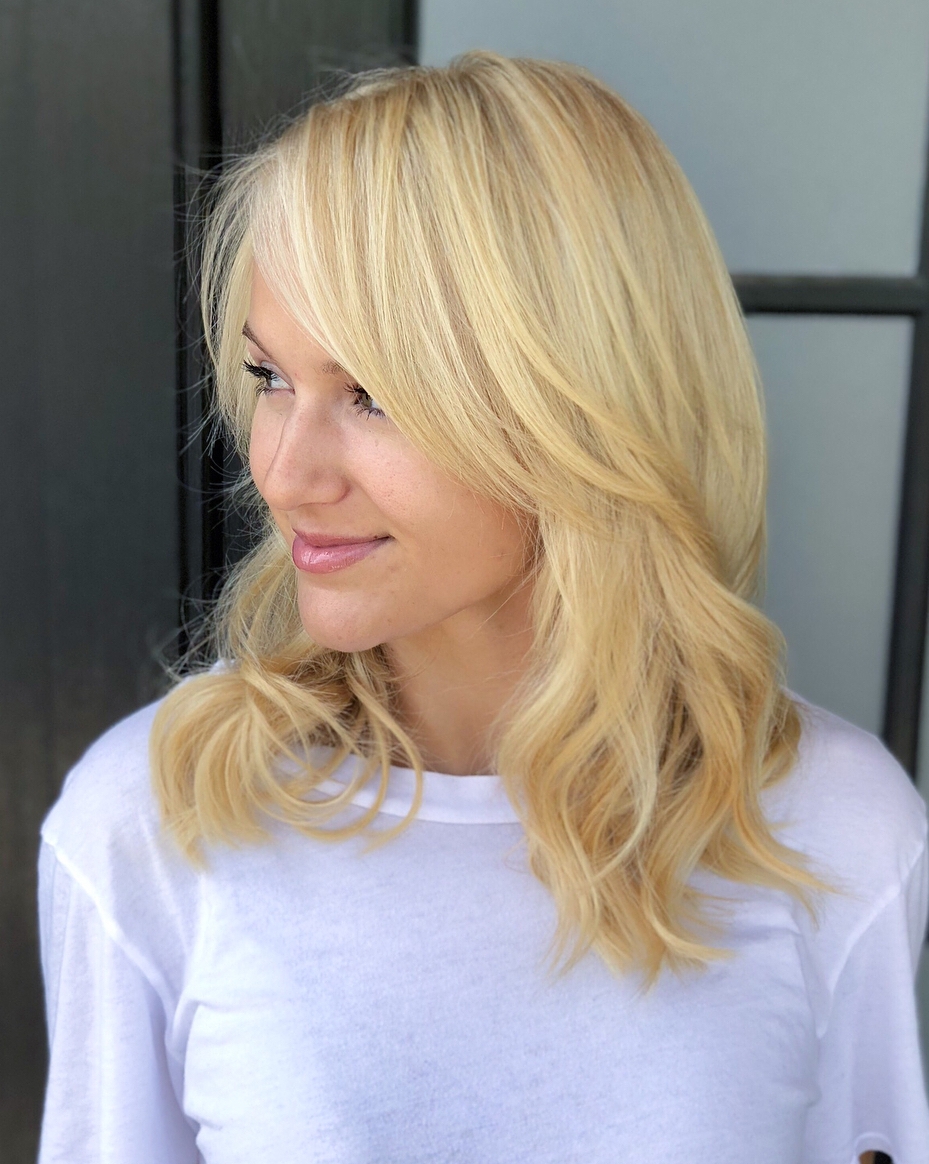 Medium Layered Butter Blonde Hairstyle