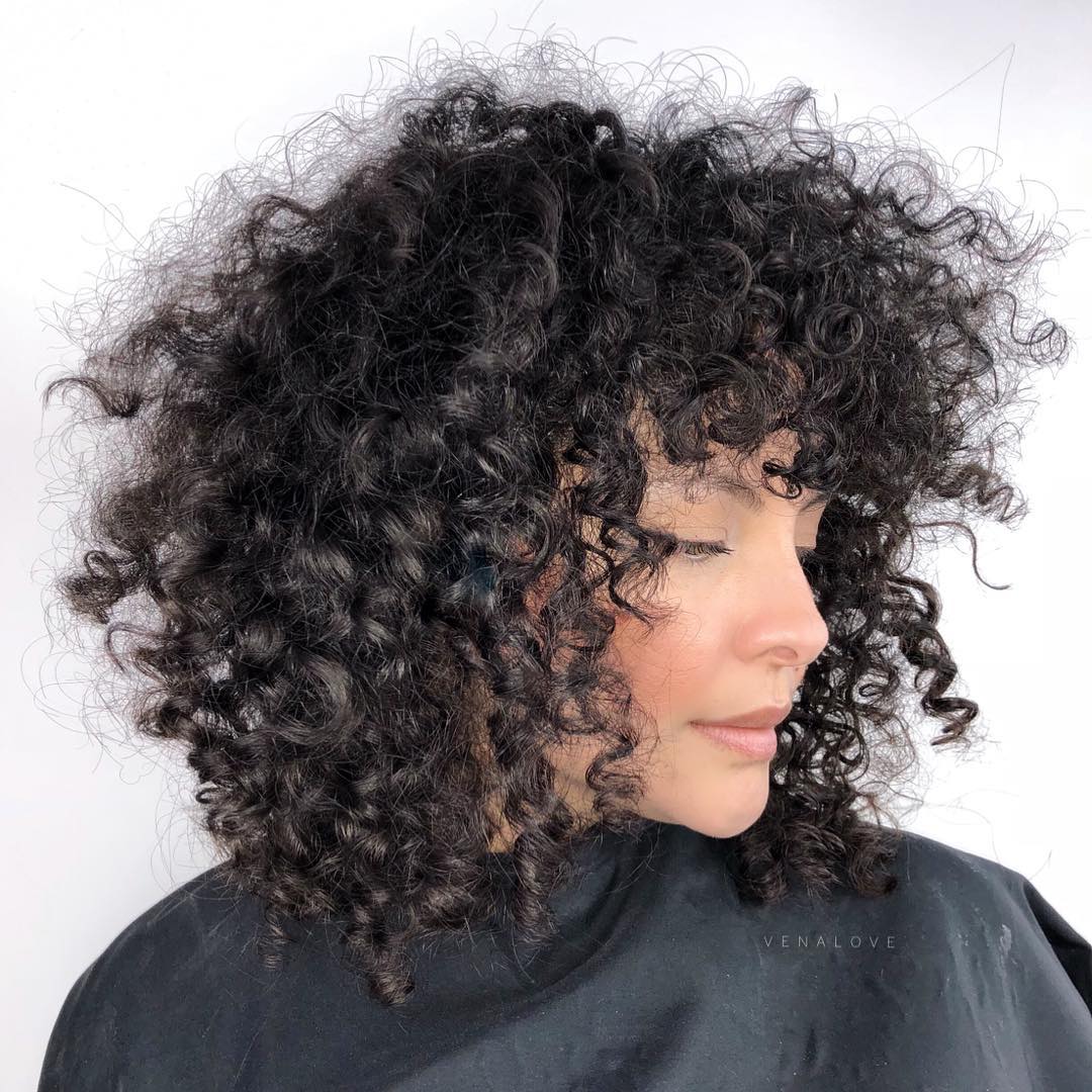 Medium Natural Curly Hairstyle With Bangs