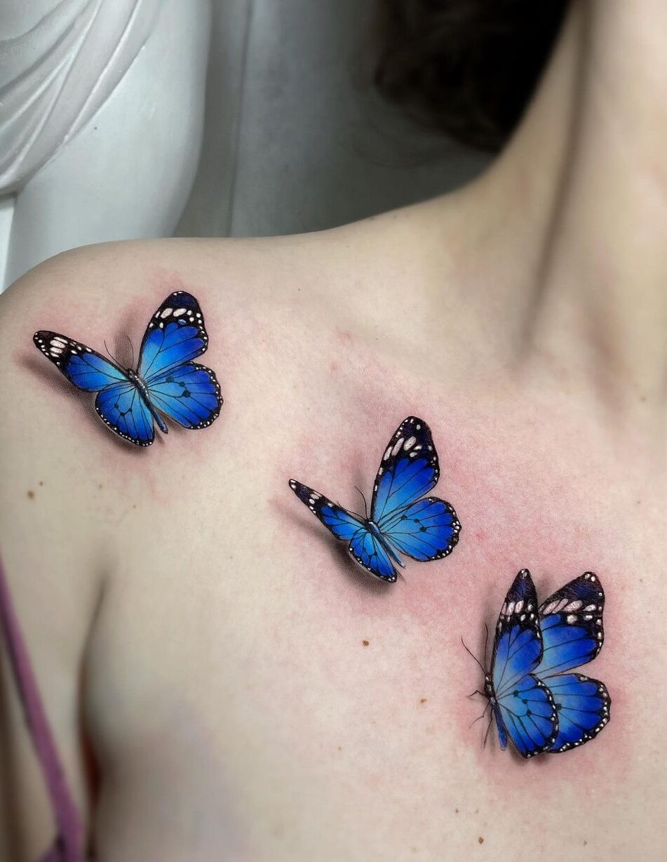 Blue 3d butterfly tattoos on shoulder