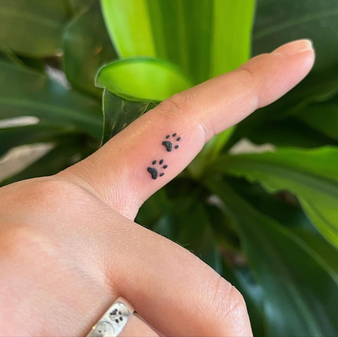 Cute Paw Print Tattoo on Index Finger