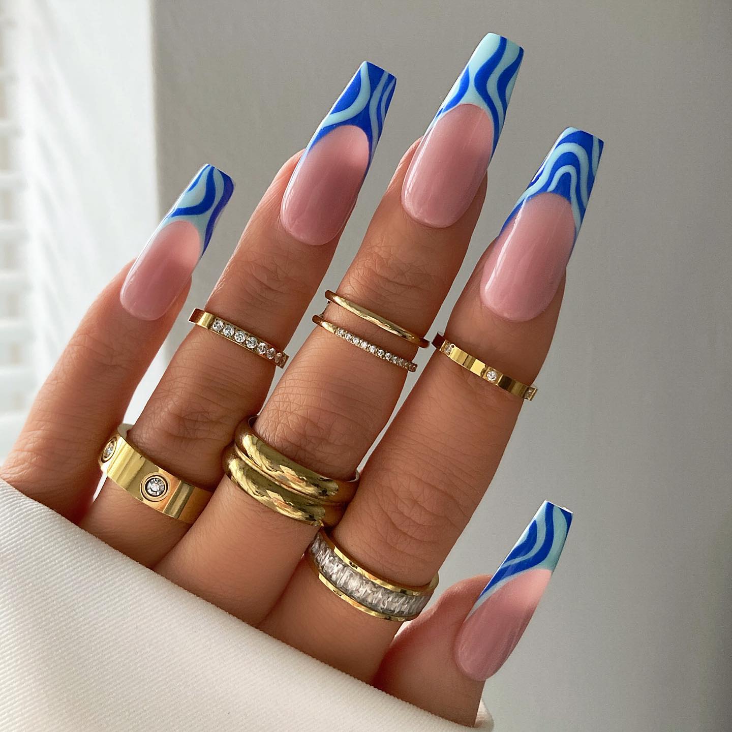 French Nails with Blue Geometric Swirls