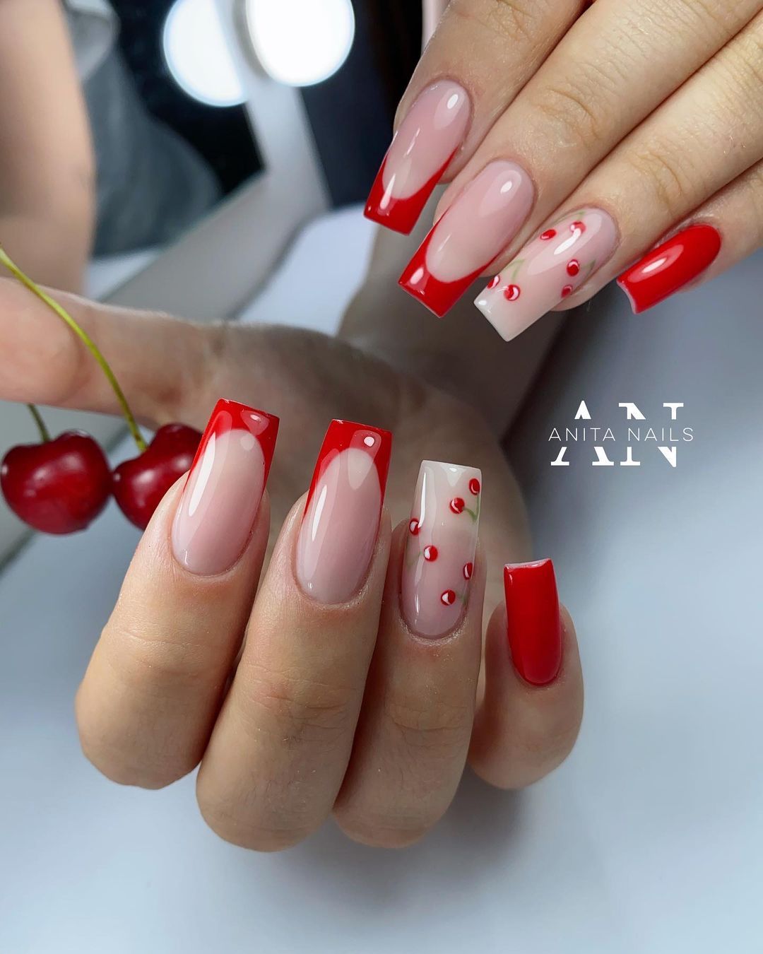 Long Nails with Red Tips and Cherry Design