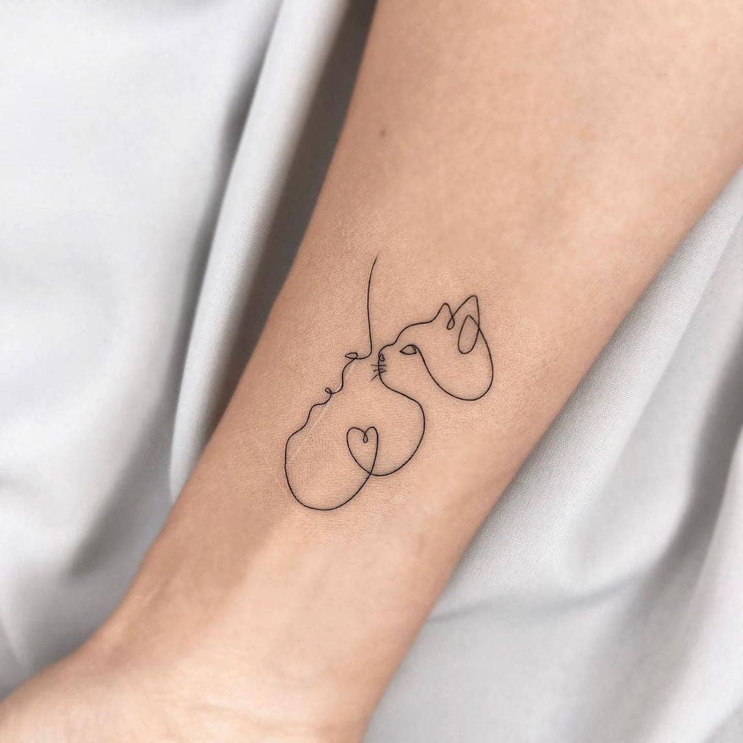 Enigmatic Minimalist Cat Tattoo