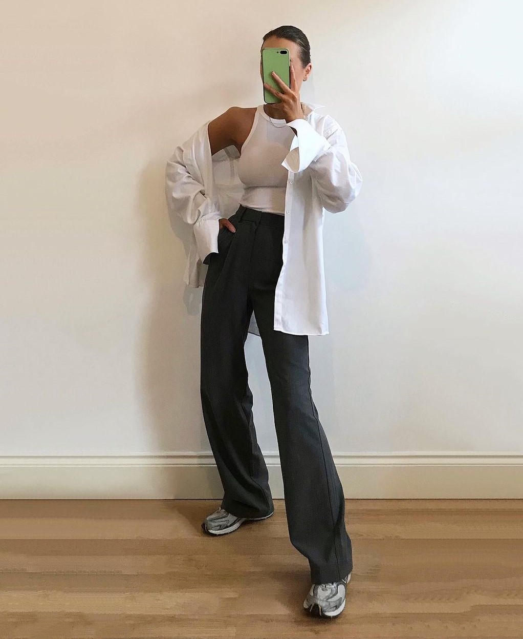 White Top with Loose Oversized Shirt and Black Trousers