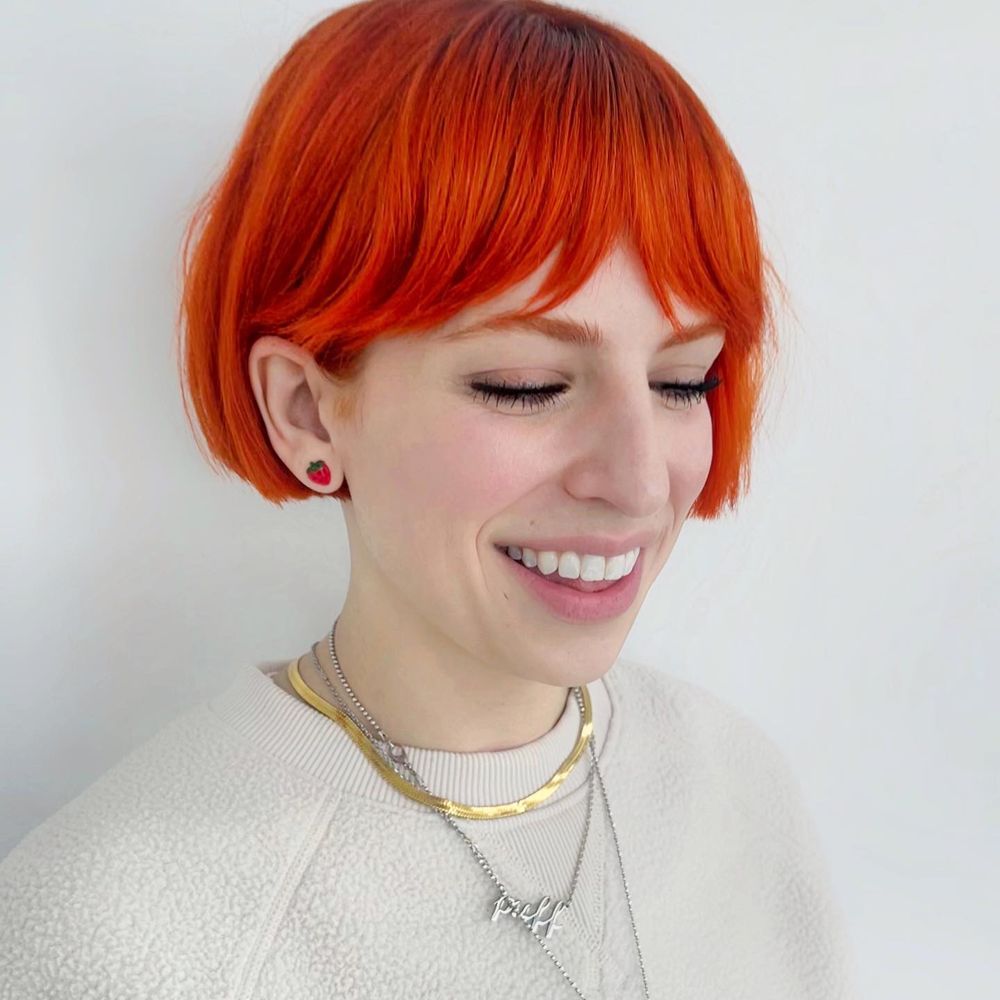 Short French Bob Cut on Neon Red Hair
