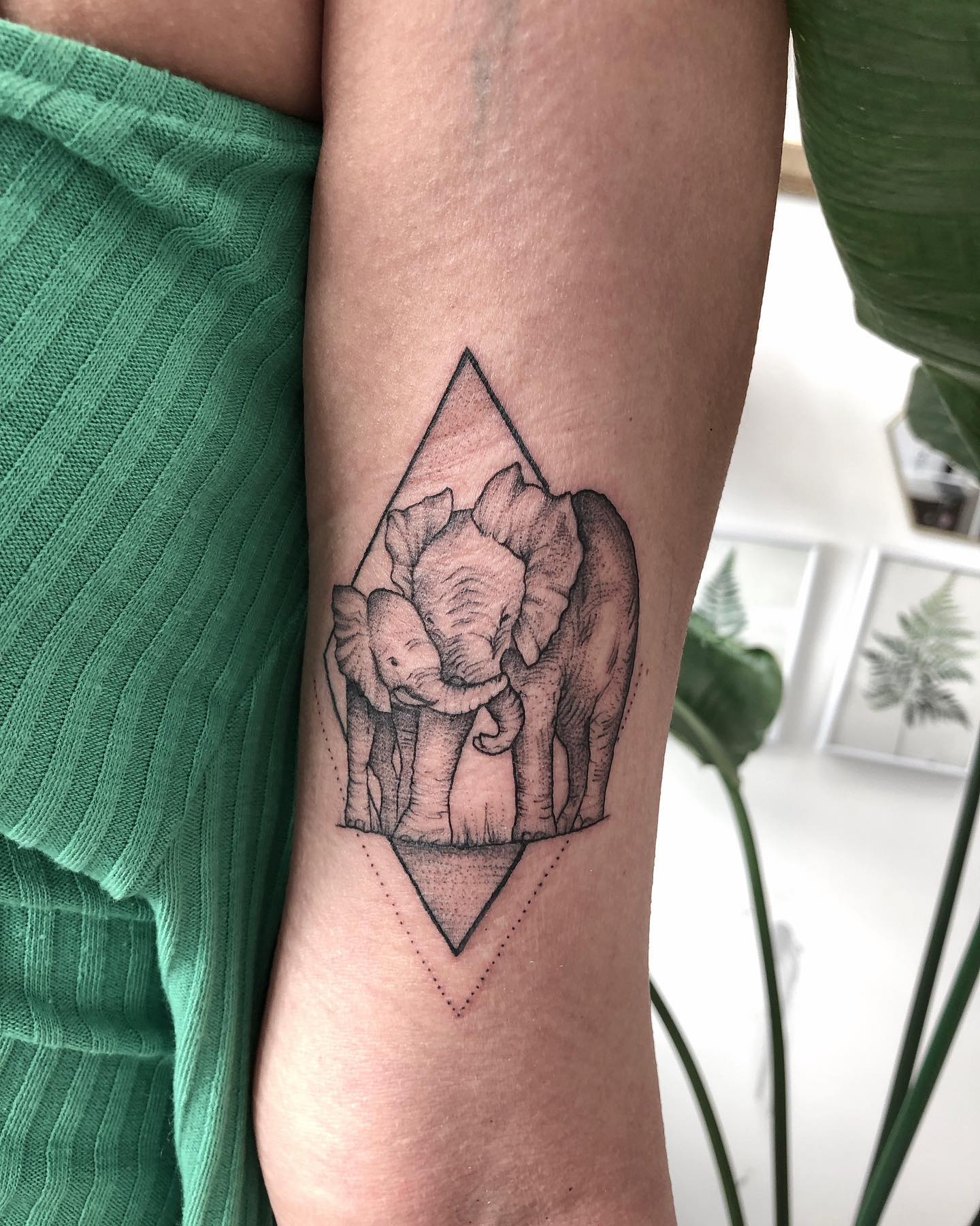 Hugging Elephants Tattoo on Arm