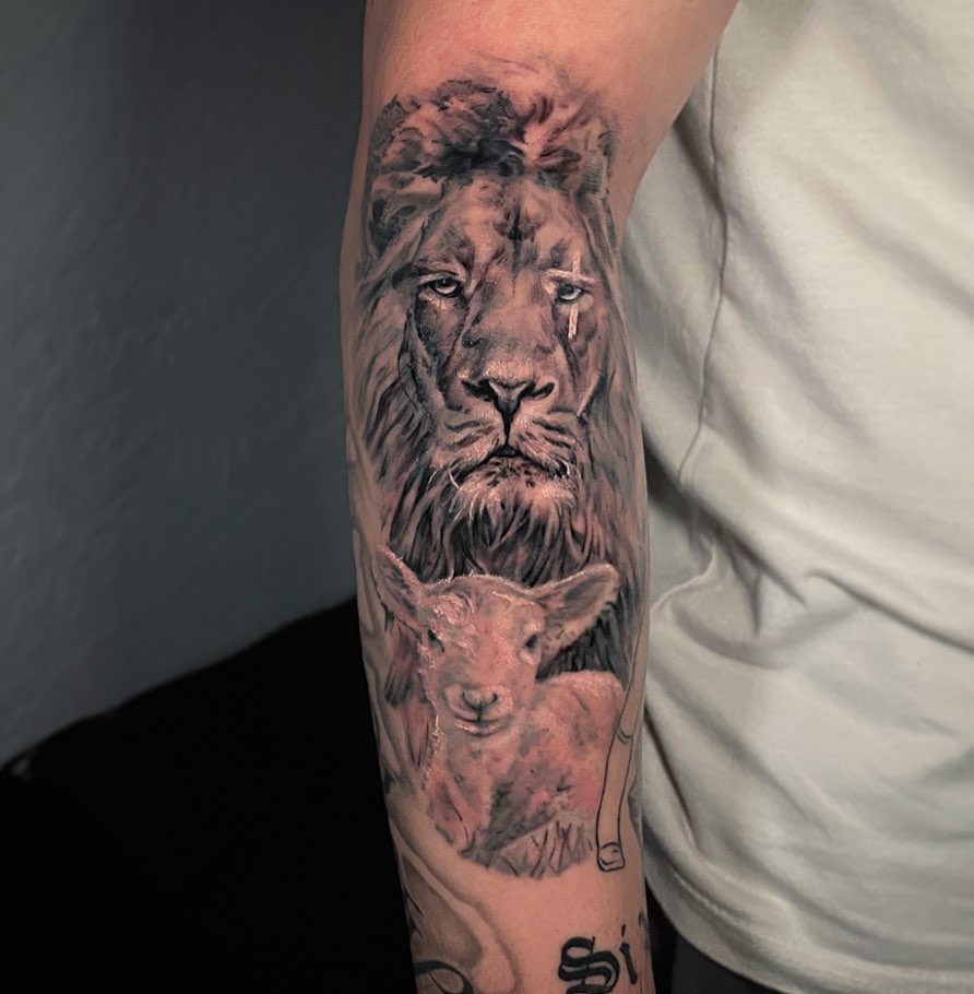 Lion and Lamb Tattoo on Arm