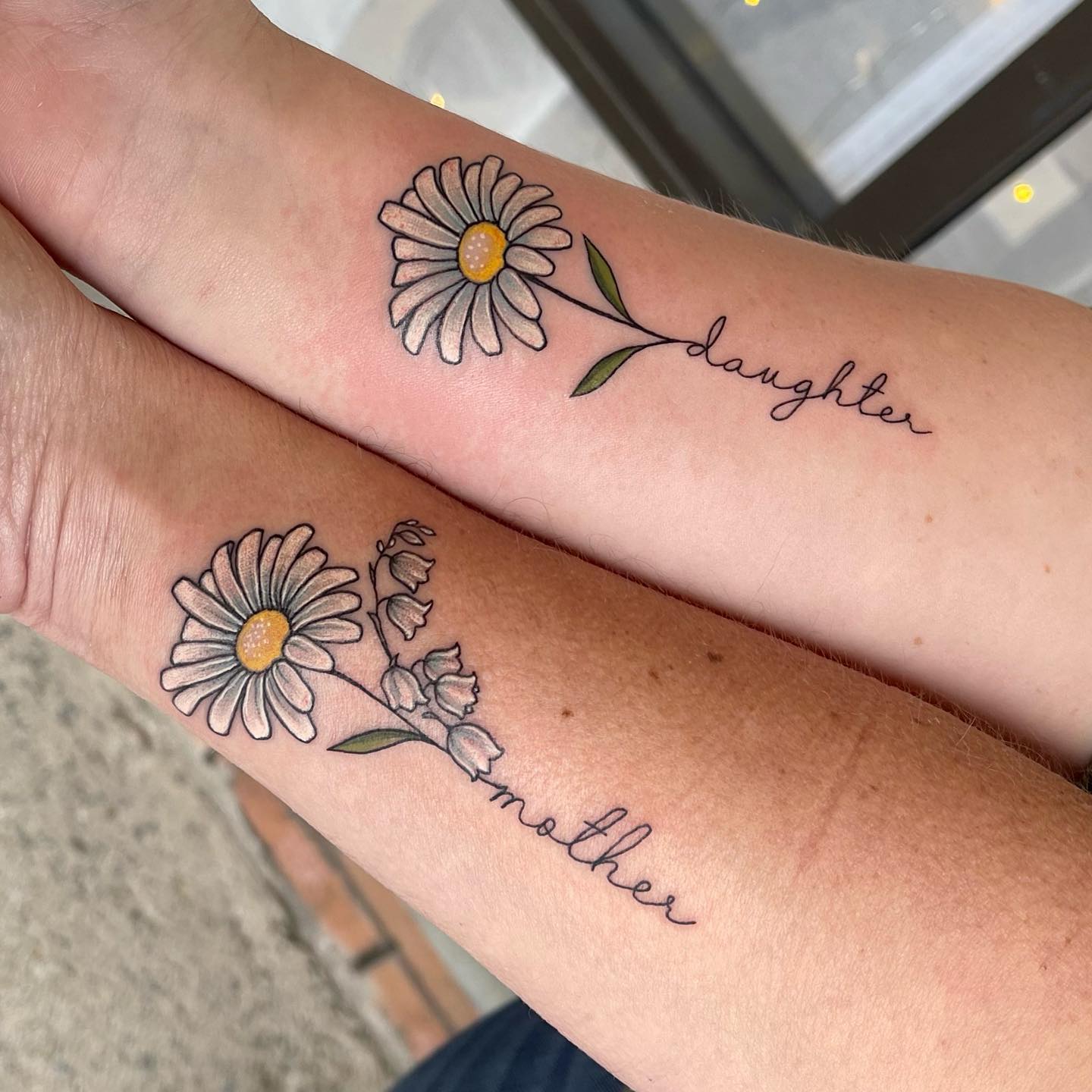 Matching Flower Mother and Daughter Tattoos on Arms
