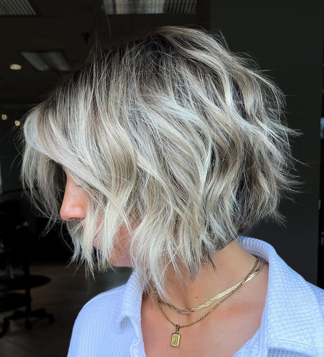 Blonde Angled Bob Haircut with Dark Roots