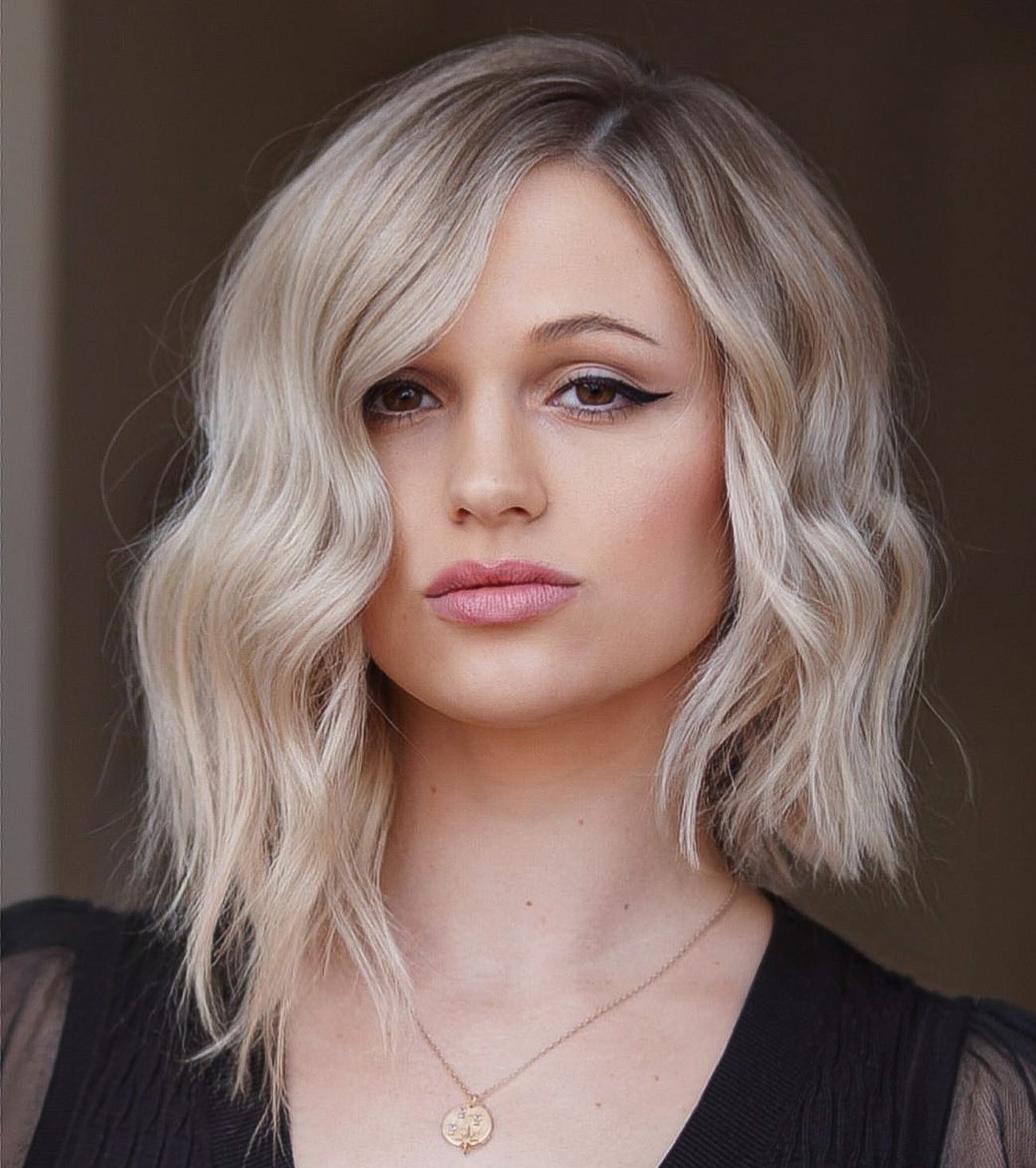 Blunt Asymmetrical Bob Cut on Blonde Hair