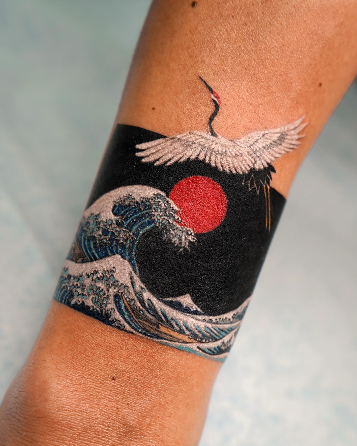 Colorful Japanese Sun Tattoo on Wrist