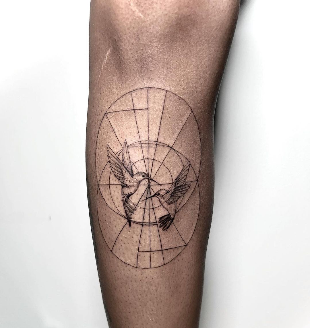 Hummingbird Tattoo with Geometric Circles on Leg
