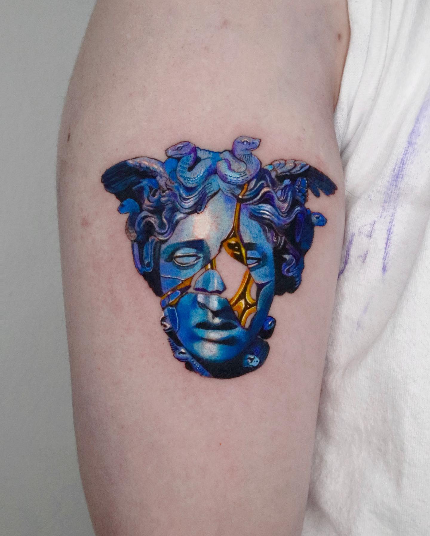 Blue Medusa Head Statue Tattoo on Arm