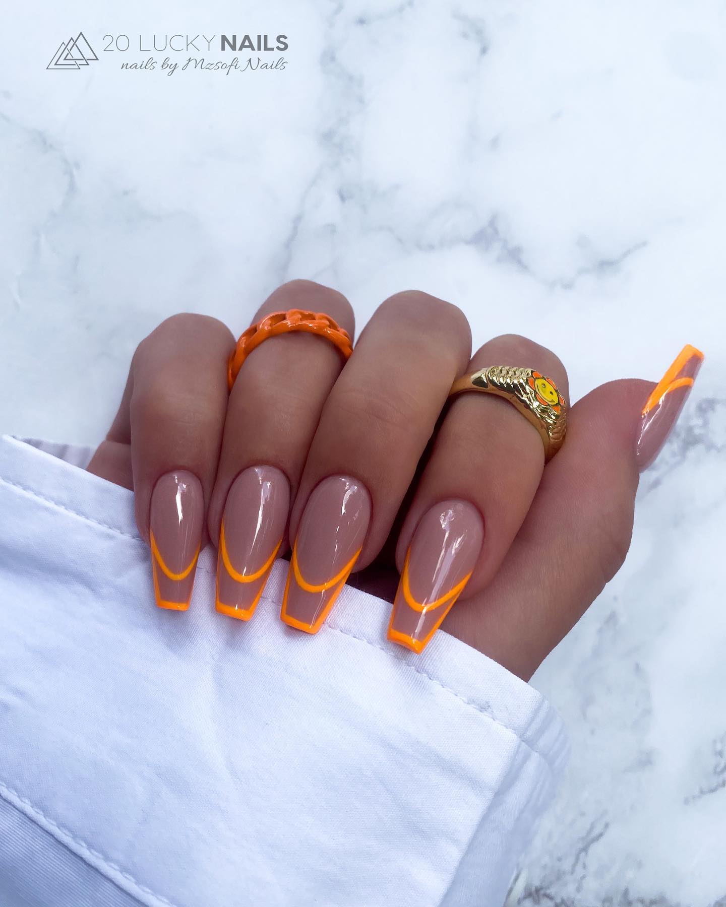 Coffin Nude Nails with Orange Lines on Tips