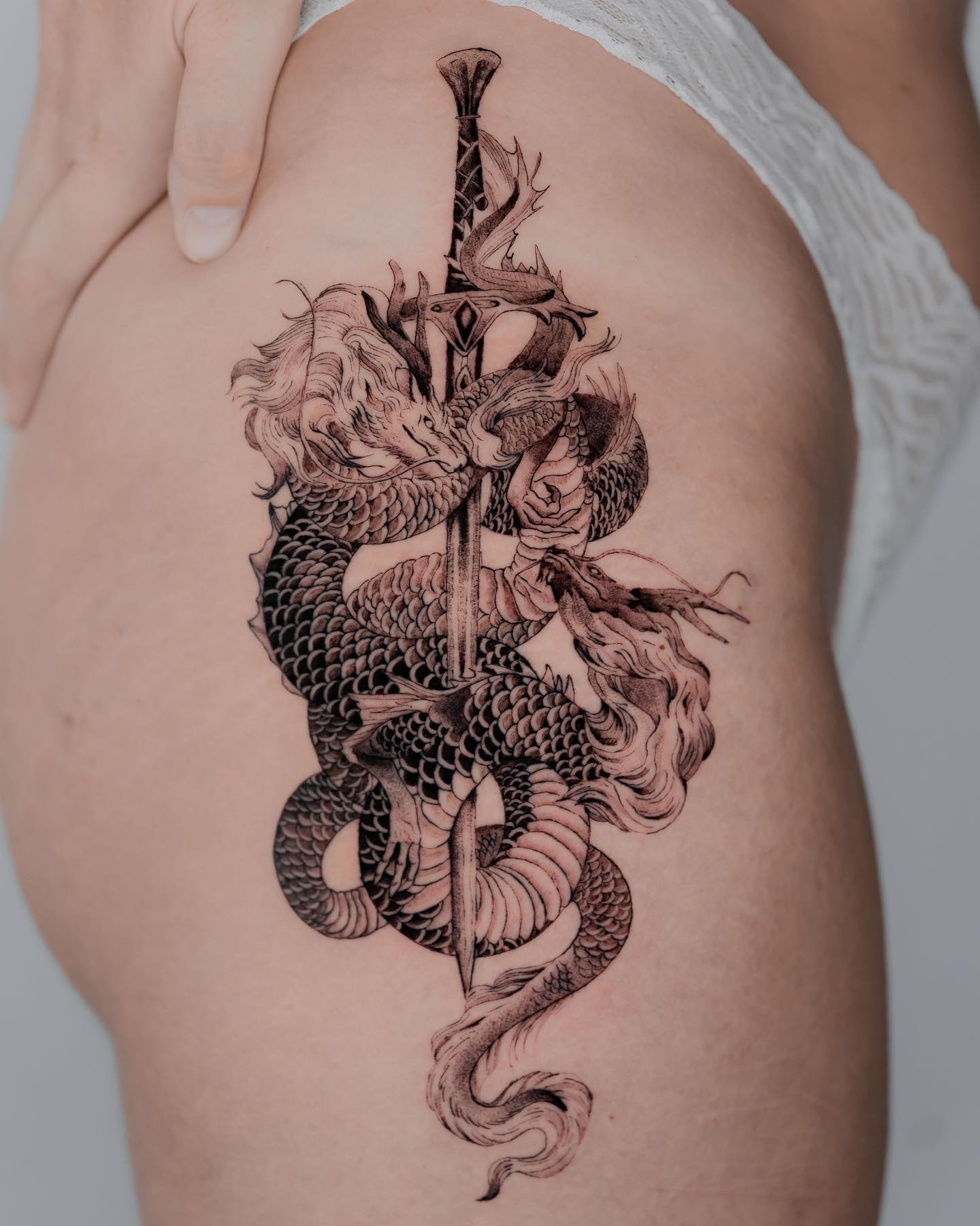 Dragon and Sword Tattoo on Thigh