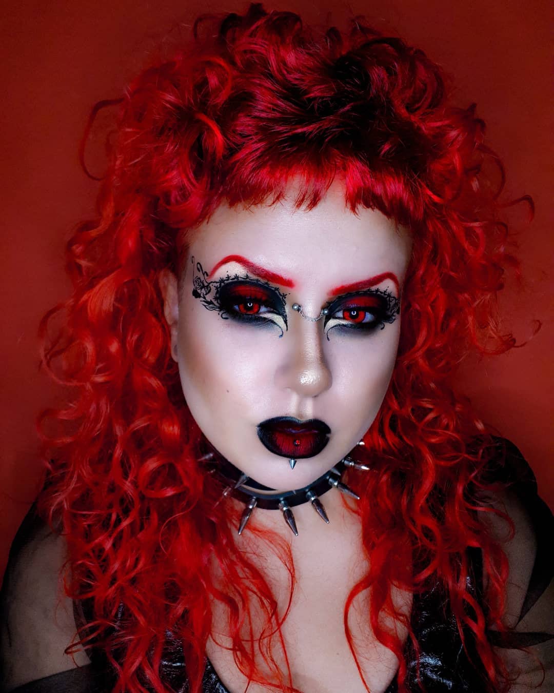 Goth Makeup with Red and Black Eyeshadow and Red Brows