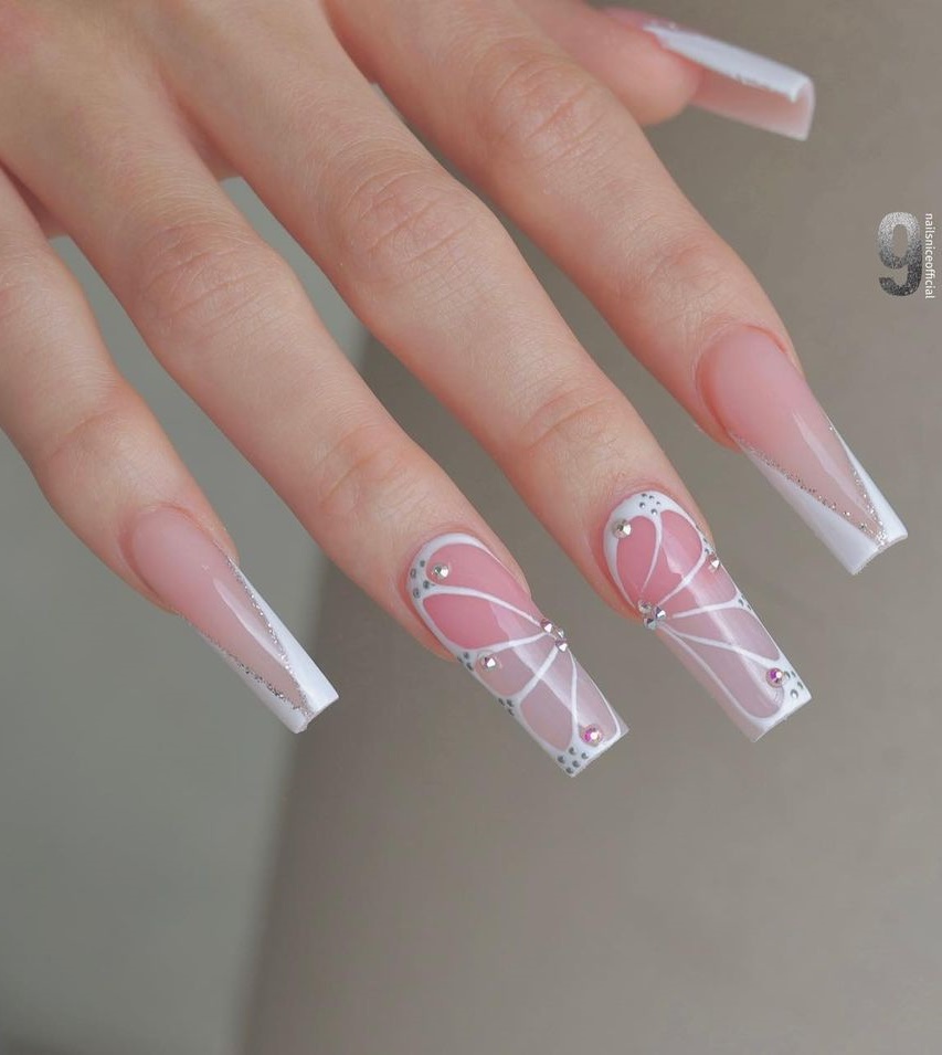 Long Clear Nails with Butterfly Design