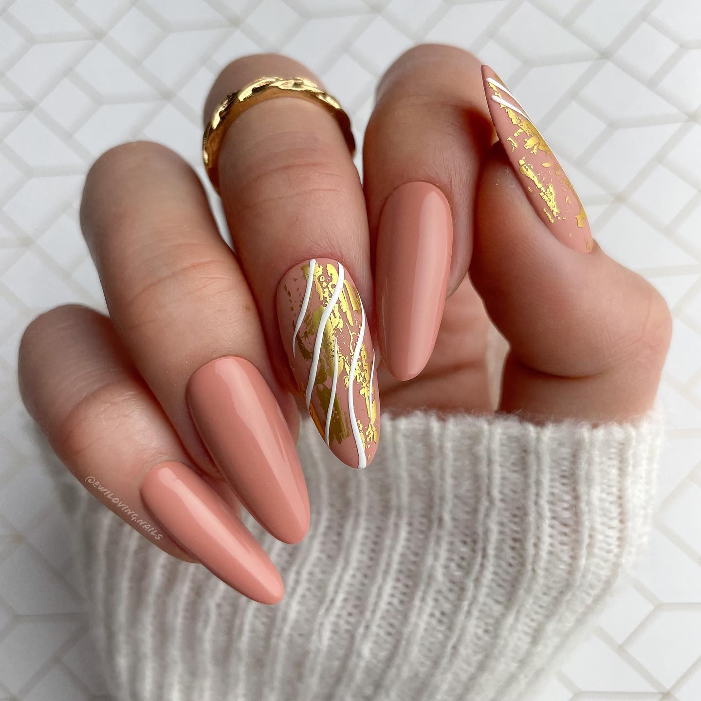 Long Round Beige Nails with White Swirls and Golden Foil