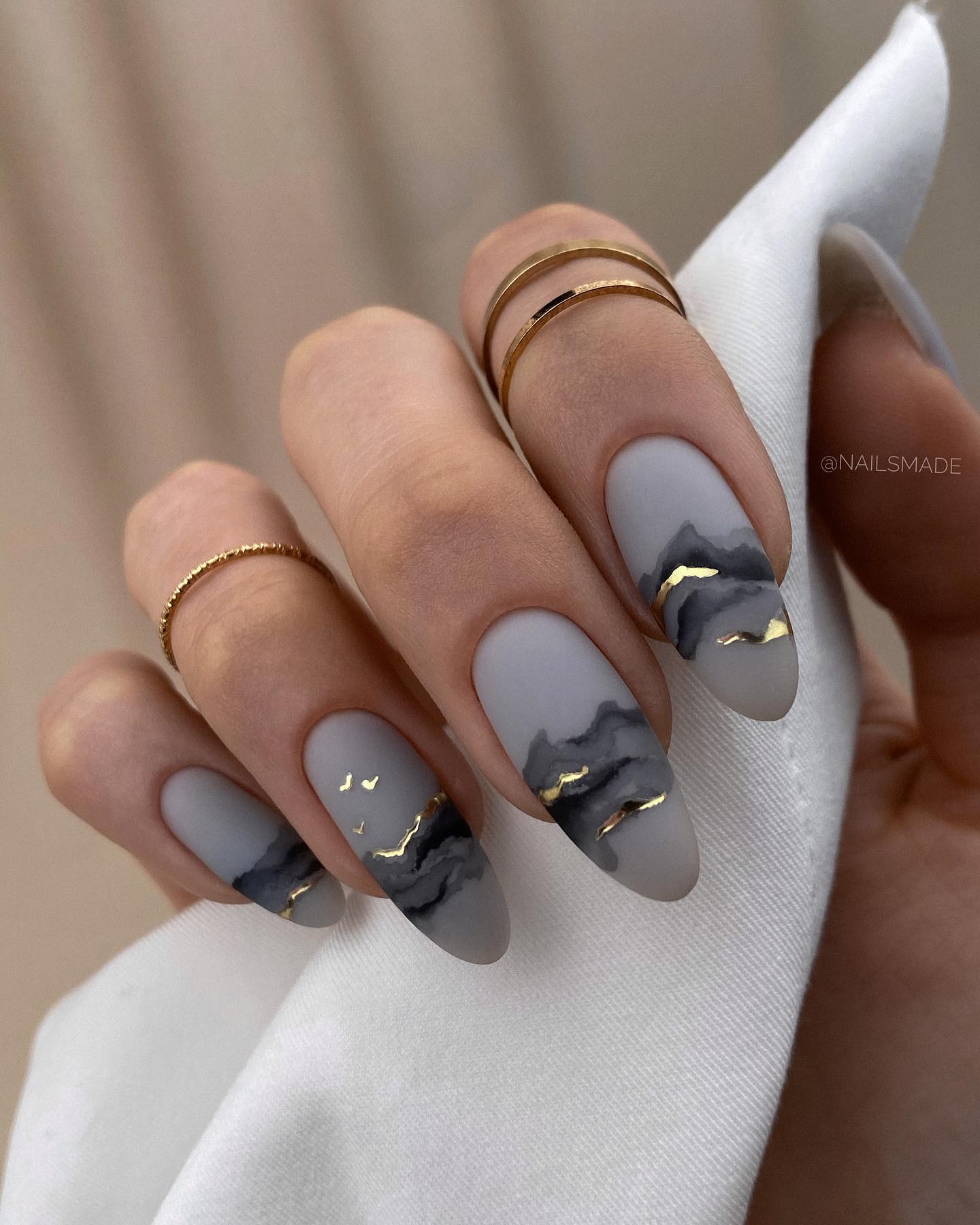 Matte Grey Nails with Black and Gold Design