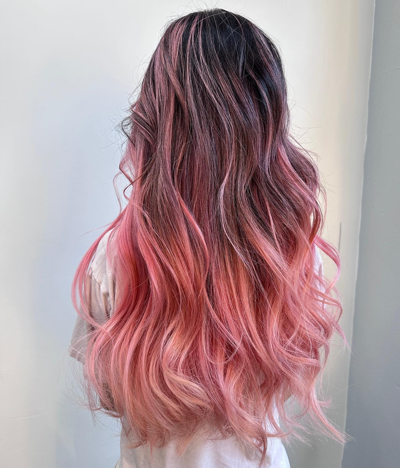 Peachy Pink Highlights on Long Dark Hair