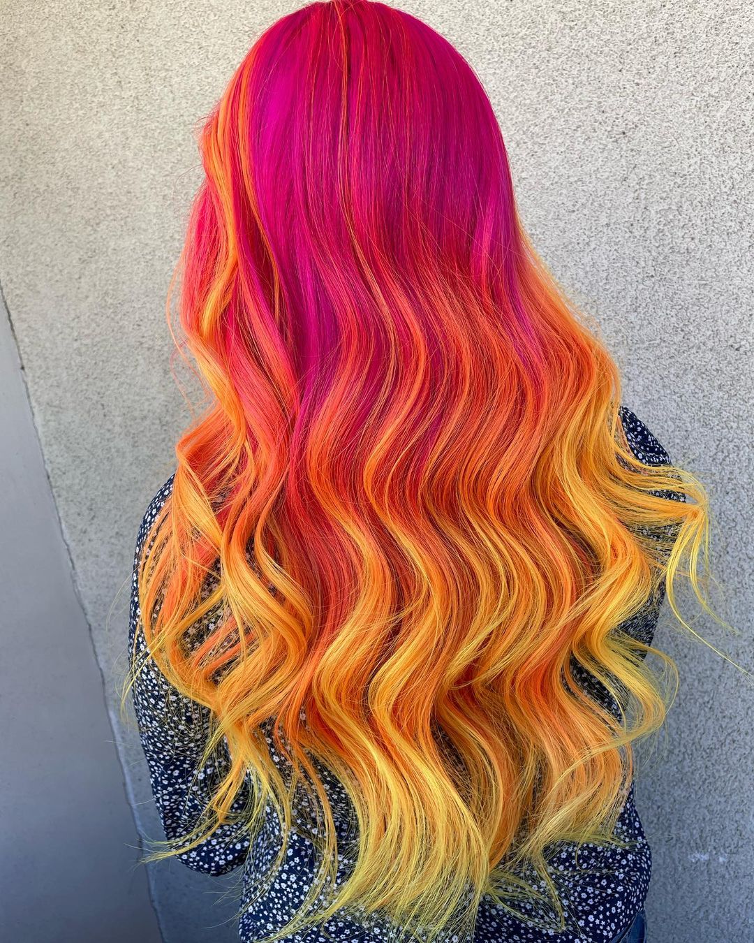 Pink to Orange Balayage on Long Wavy Hair