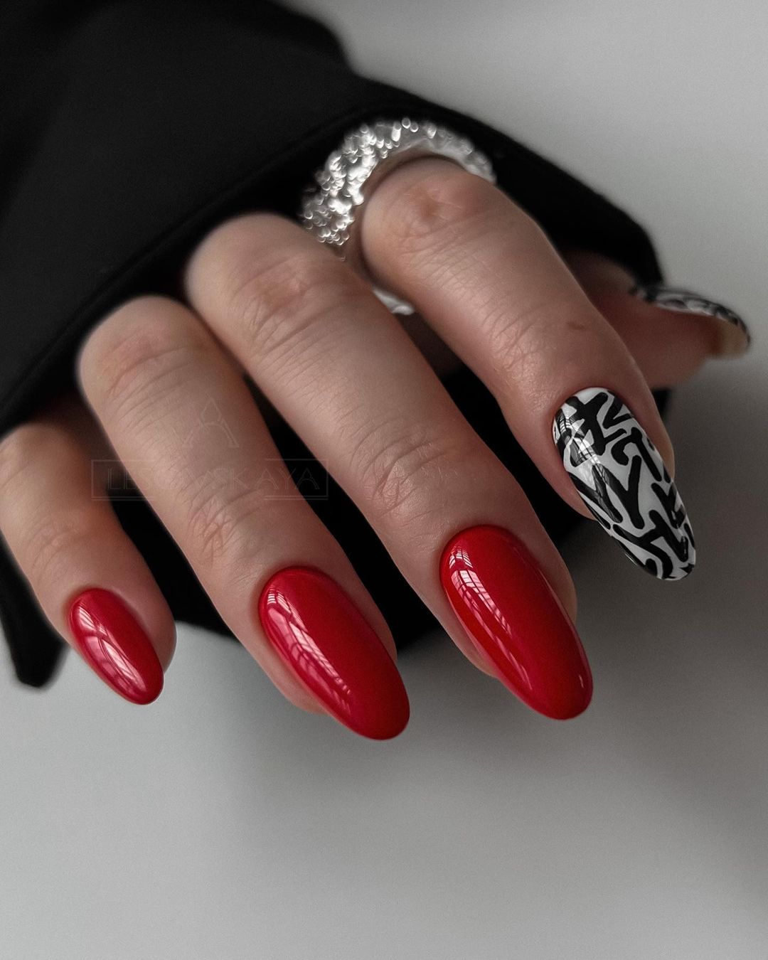 Round Red Gel Nails with Black and White Design