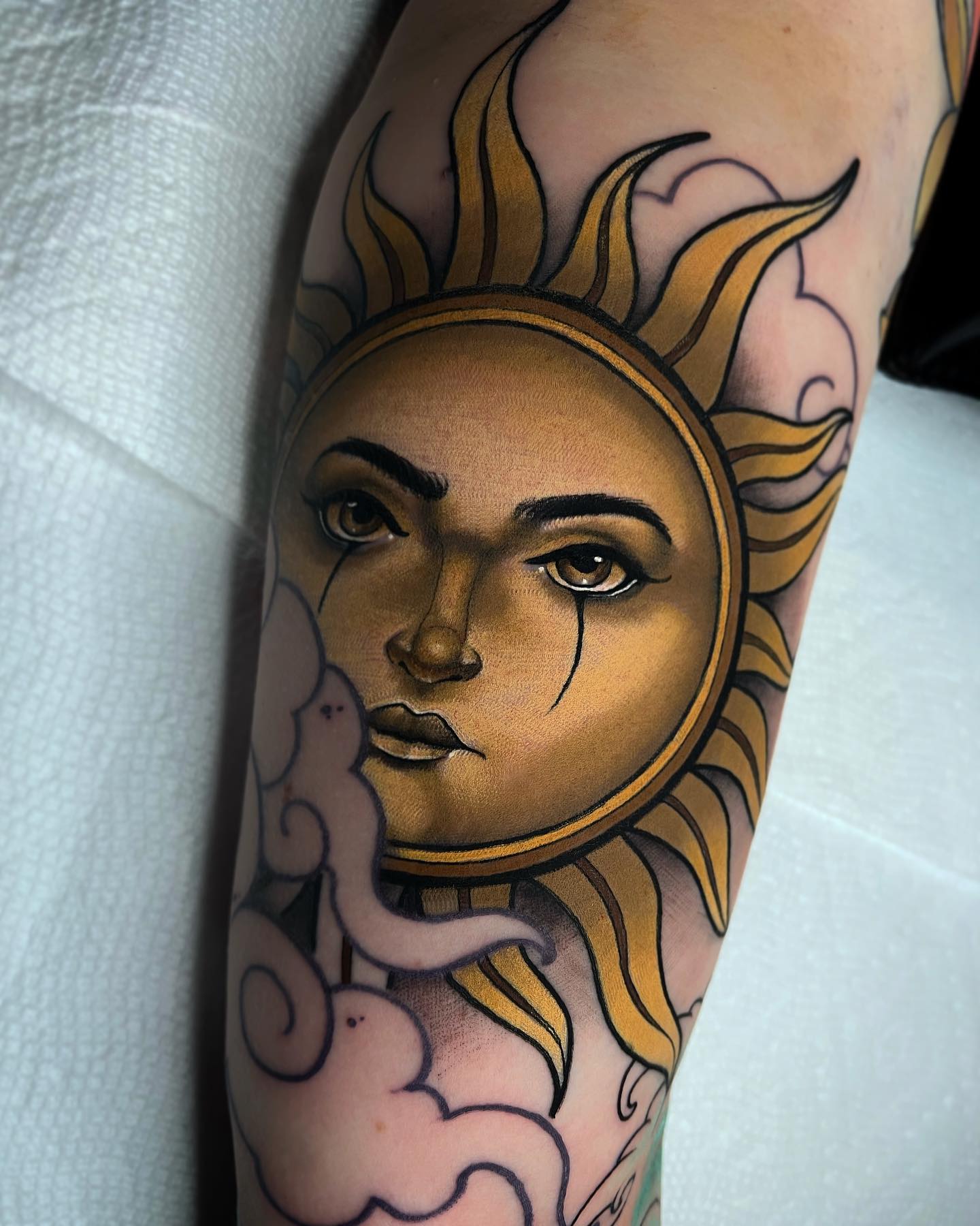 Sun Behind the Clouds Tattoo on Arm