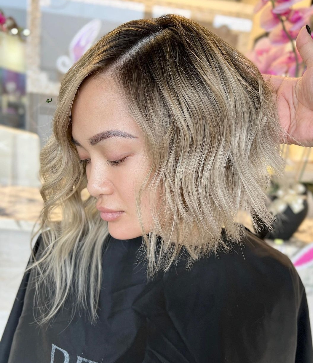 Blonde Asymmetrical Bob with Dark Roots