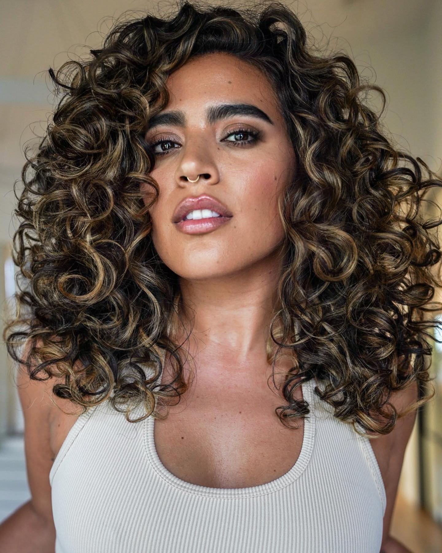 Dark Curly Hair with Blonde Highlights