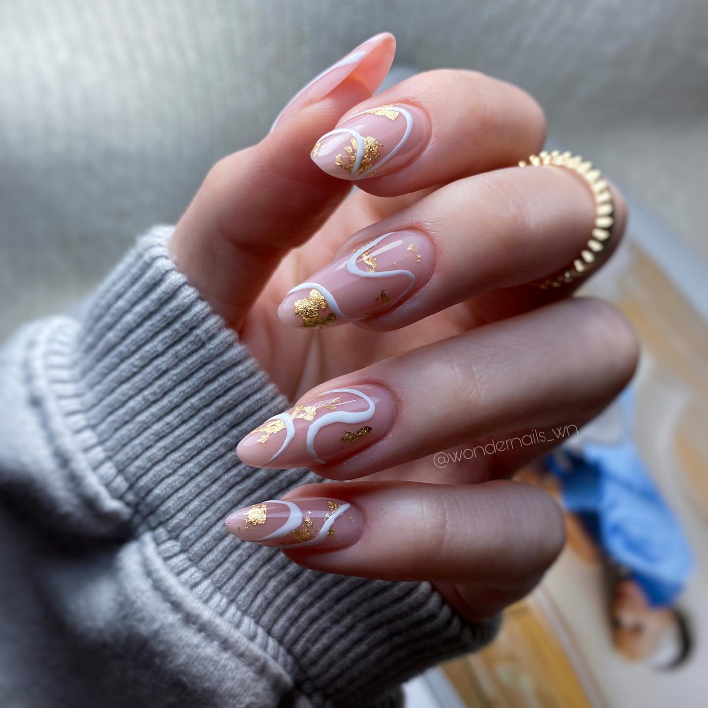 Long Round Pink Nails with White Swirls and Golden Foil