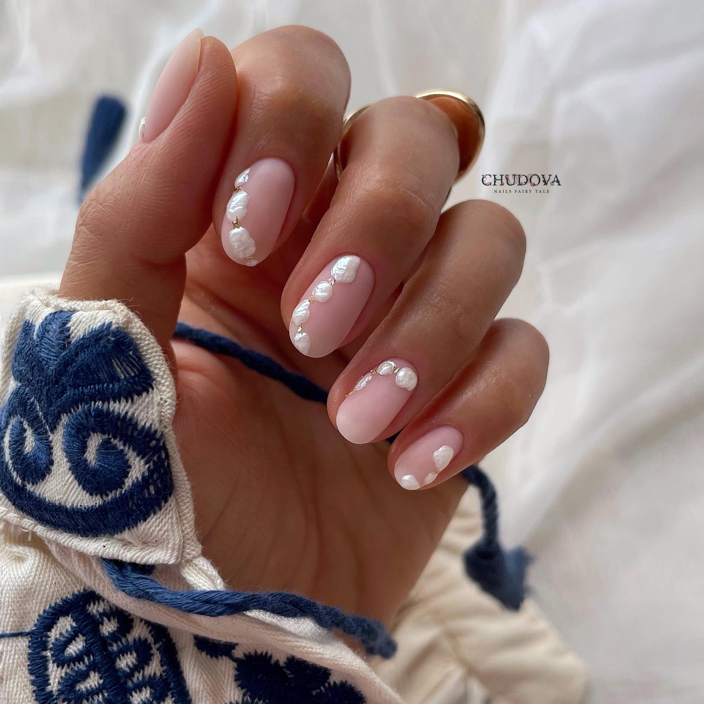 Short Oval Nude Nails with White Dots