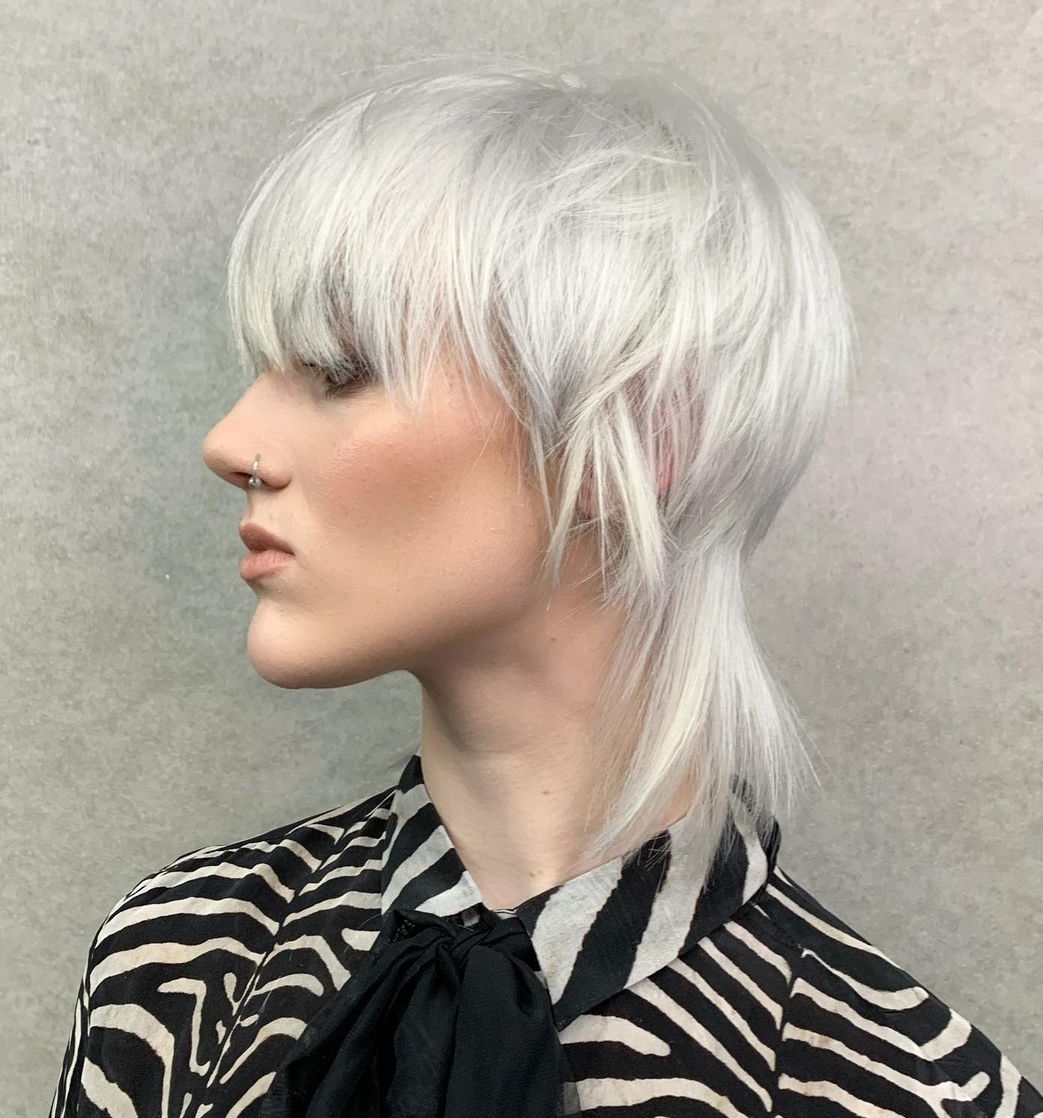 Sleek Blonde Wolf Cut with Long Bang