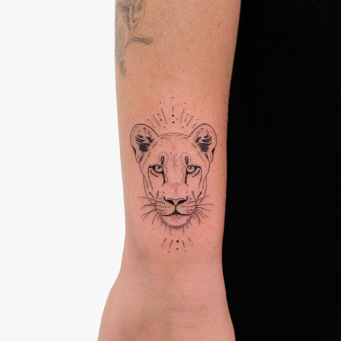 Small Lioness Head Tattoo on Wrist
