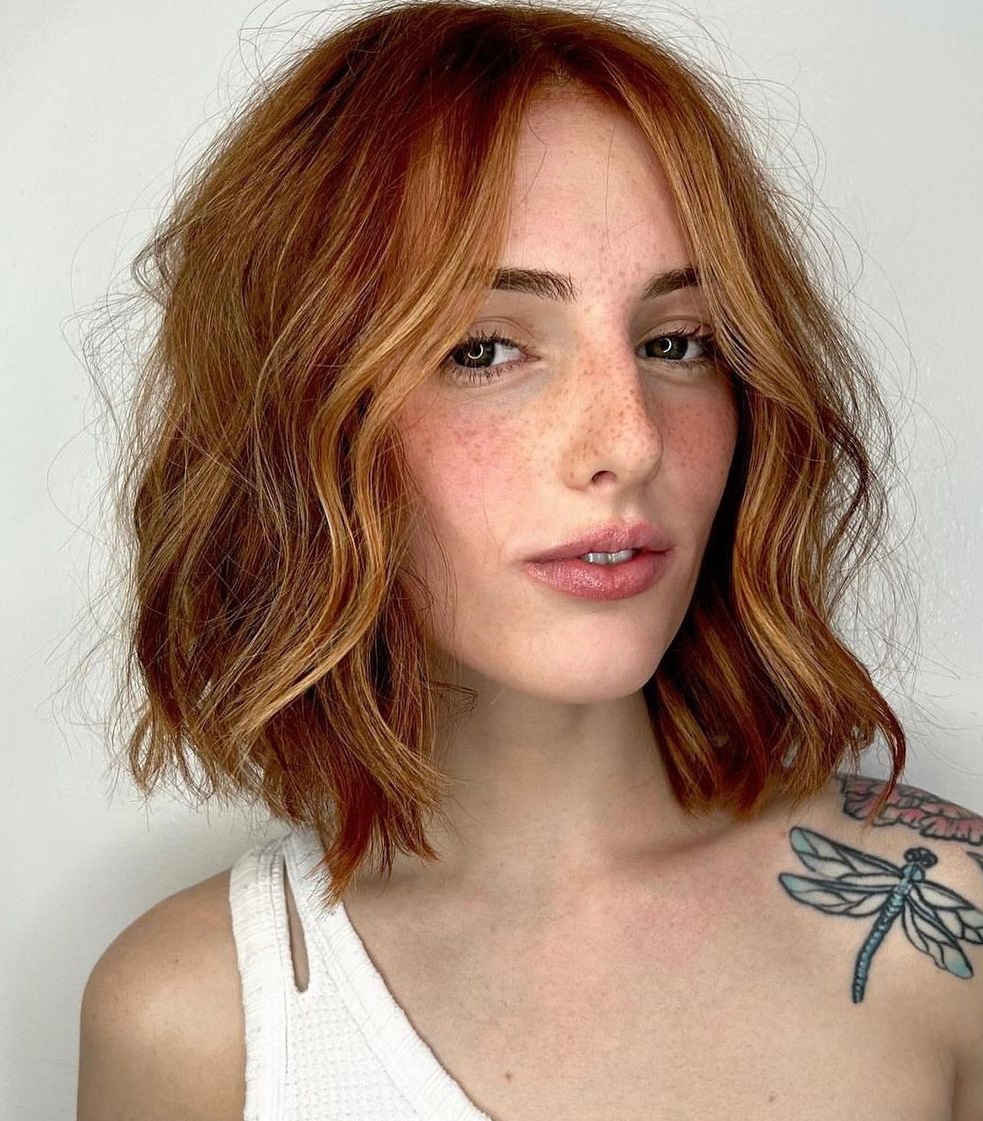 Strawberry Blonde with Red Hues on Short Bob Cut