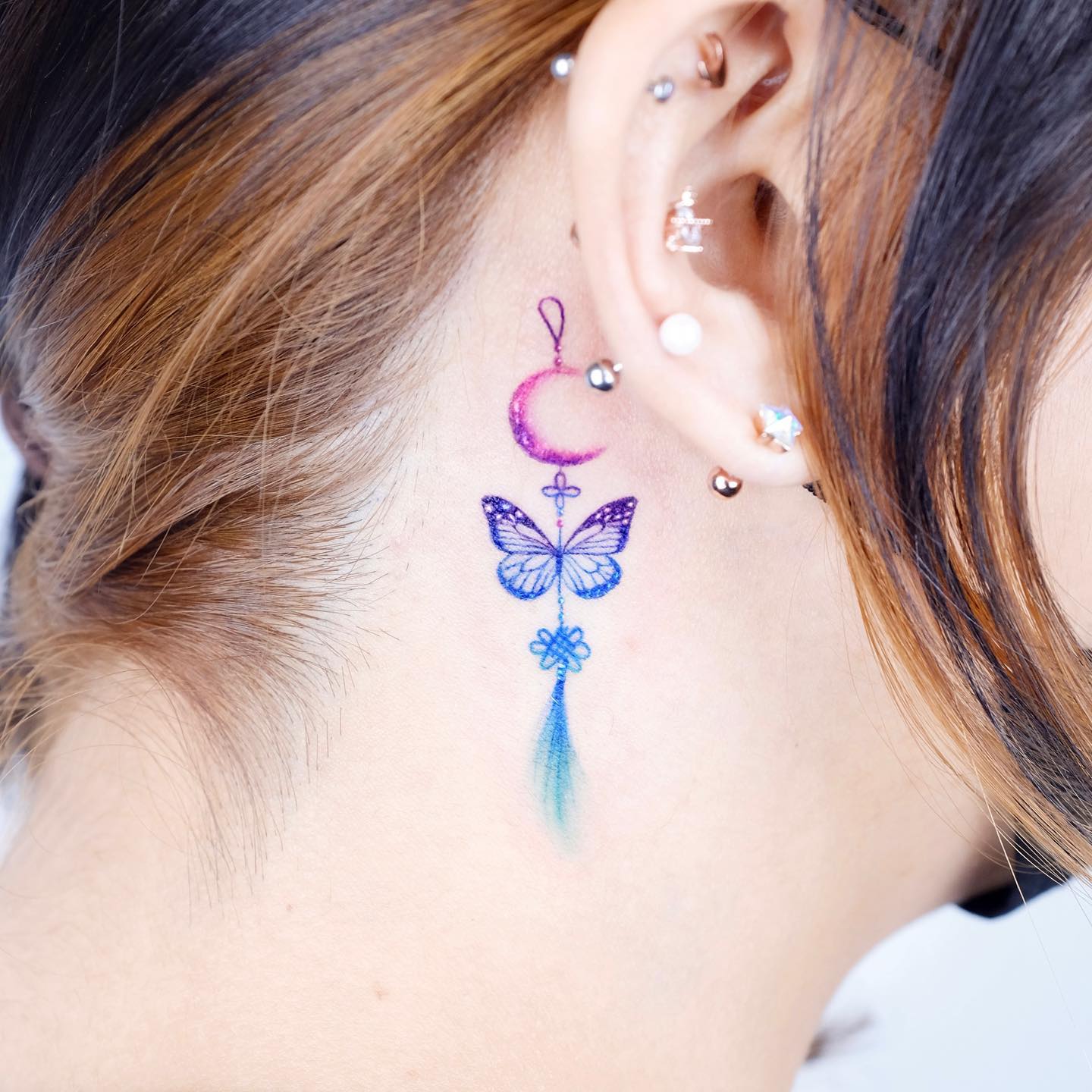 Colorful Butterfly Tattoo Behind Ear