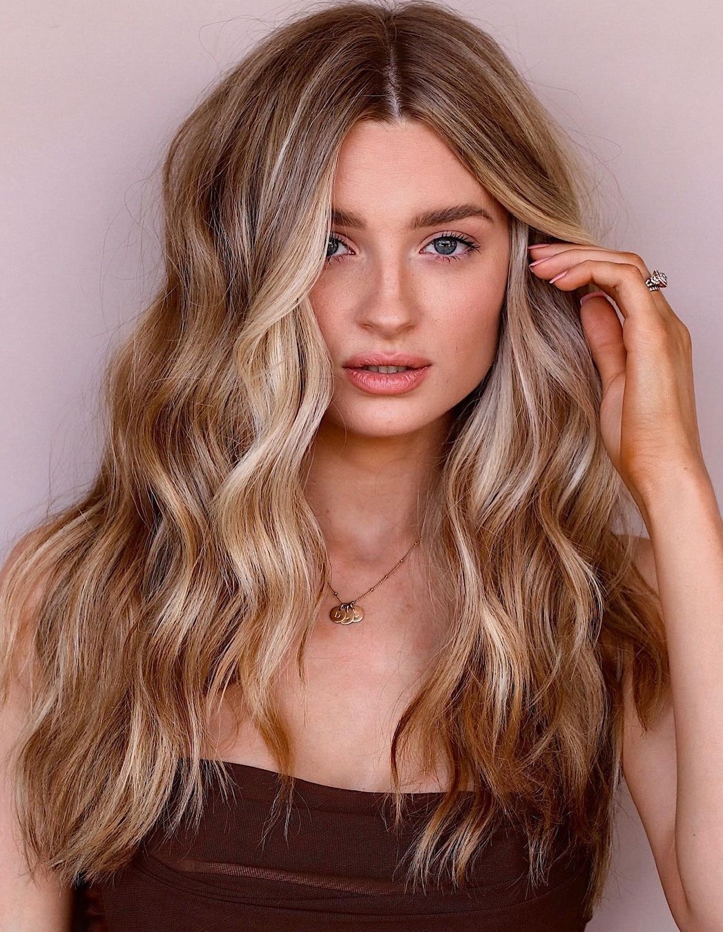 Dirty Blonde with Caramel Highlights on Wavy Long Hair