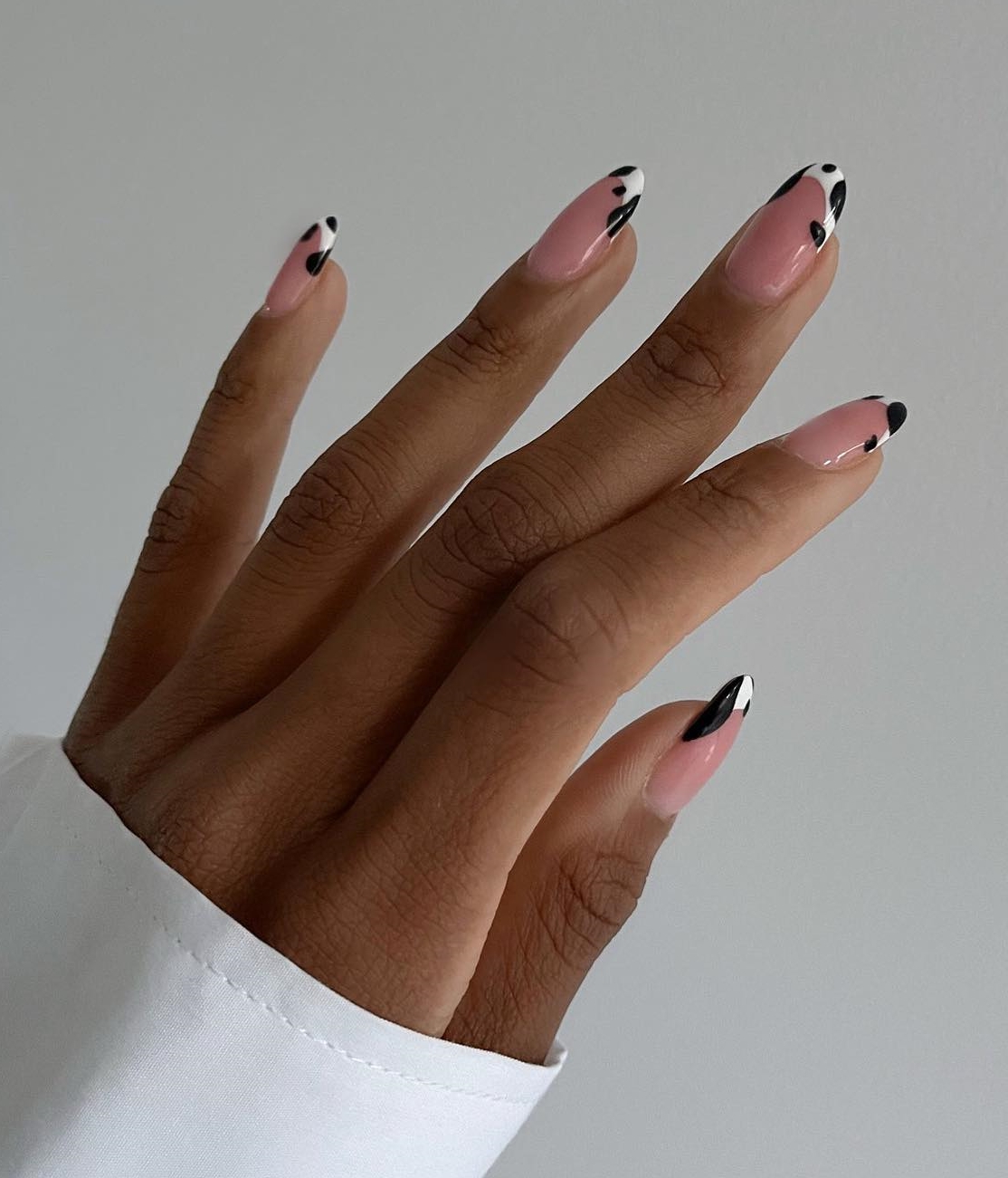 French Nail Tips with Black and White Cow Print Design