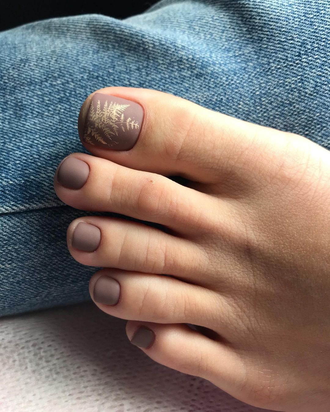 Matte Brown Toe Nails with Gold Leaf Design