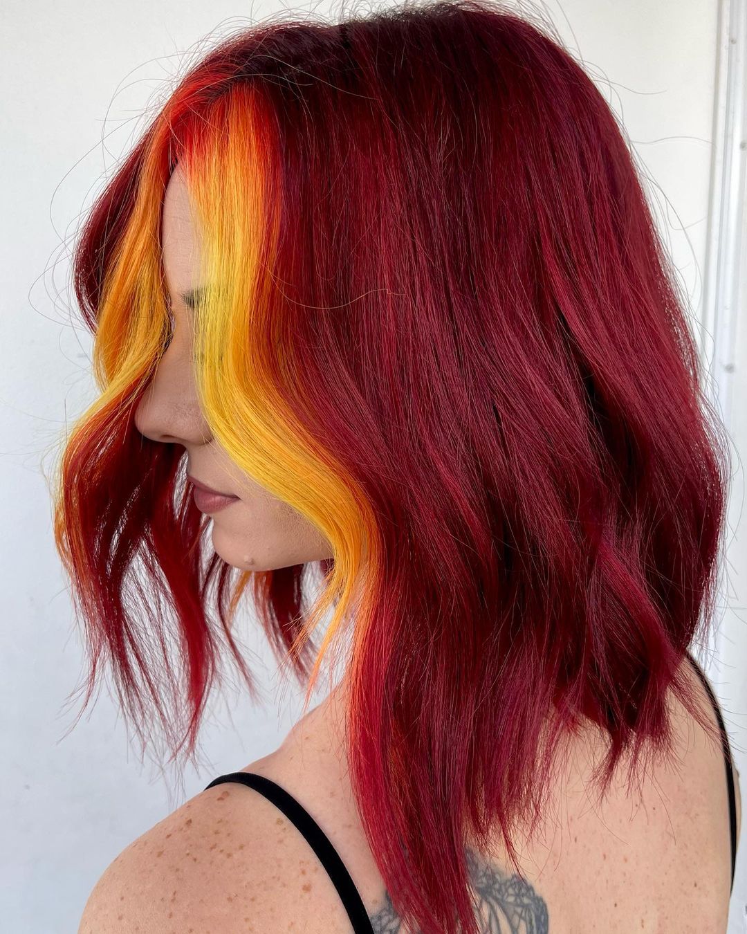 Ruby Red Hair Color with Yellow Money Piece