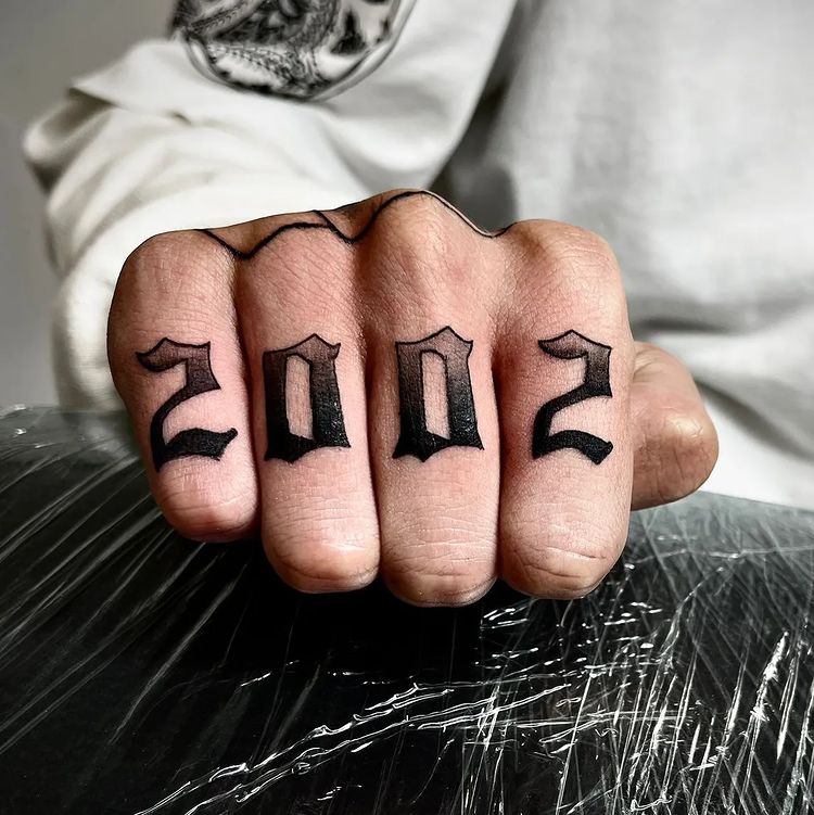 2002 Tattoo on Four Fingers