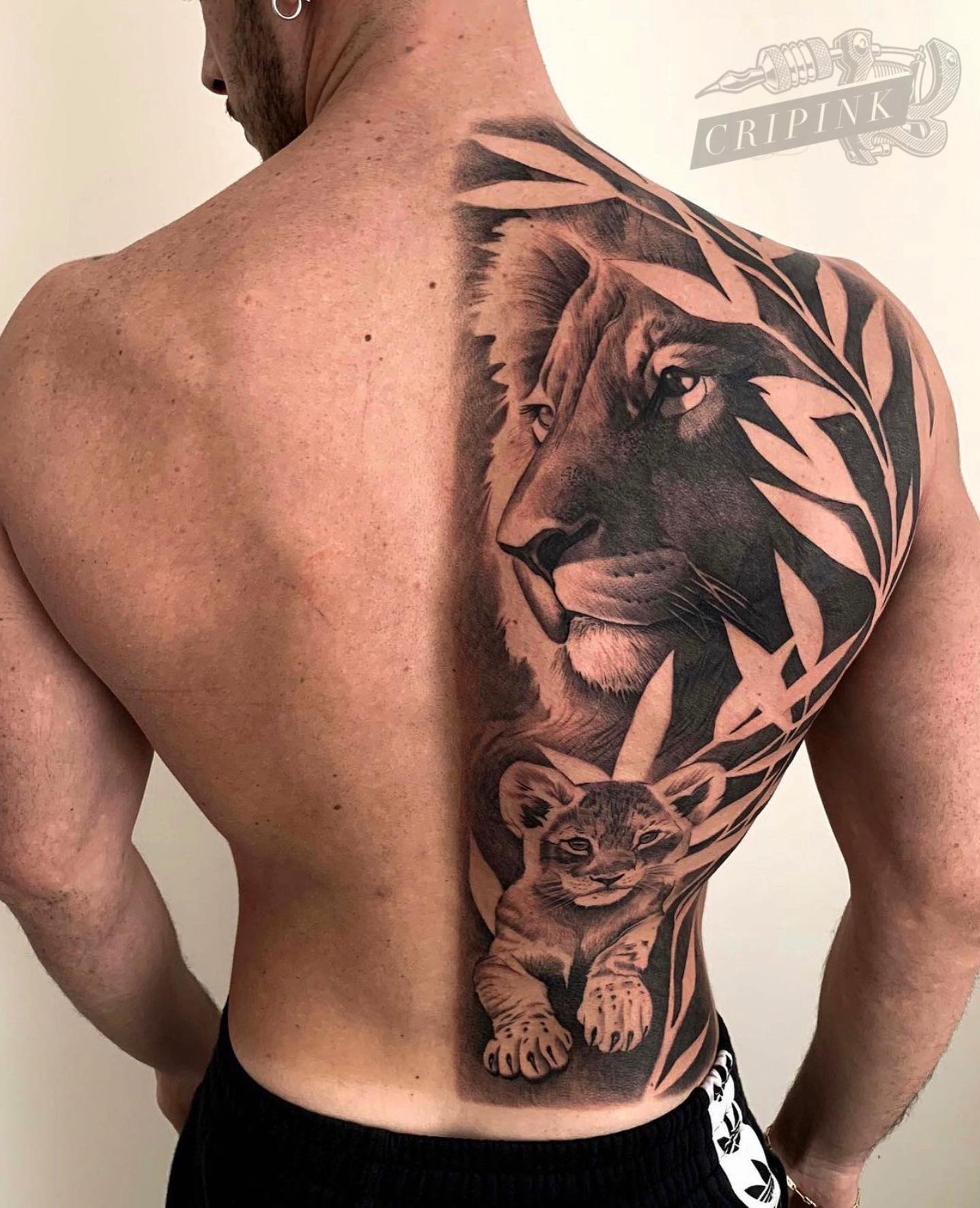 Half Back Lion Tattoo with Cub