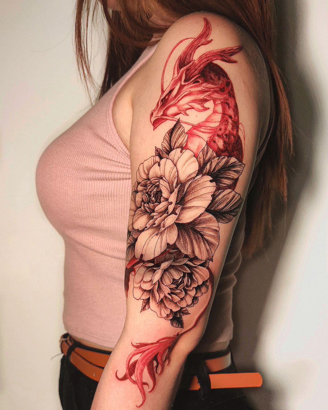 Red Dragon Tattoo with Black Flowers on Arm