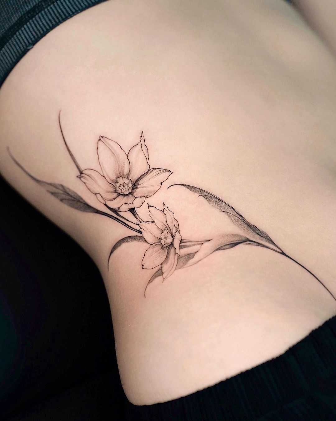 Black and White Narcissus Flower Tattoo on Side