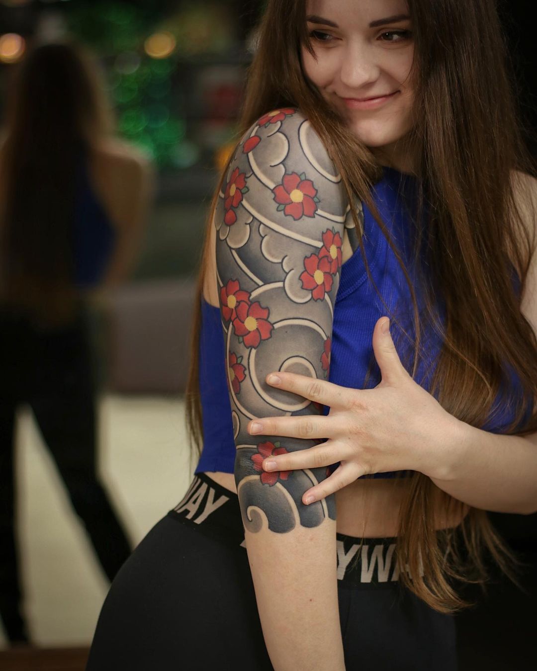 Cloud and Flowers Tattoo on Arm
