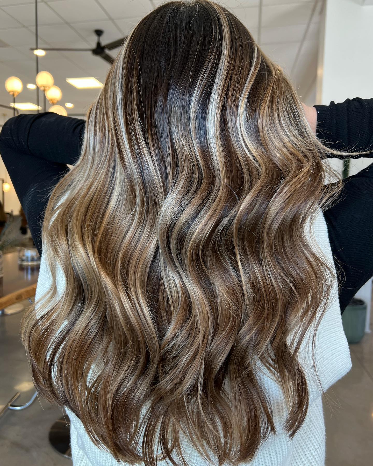 Coffee Brown Lowlights and Blonde Highlights on Long Wavy Hair