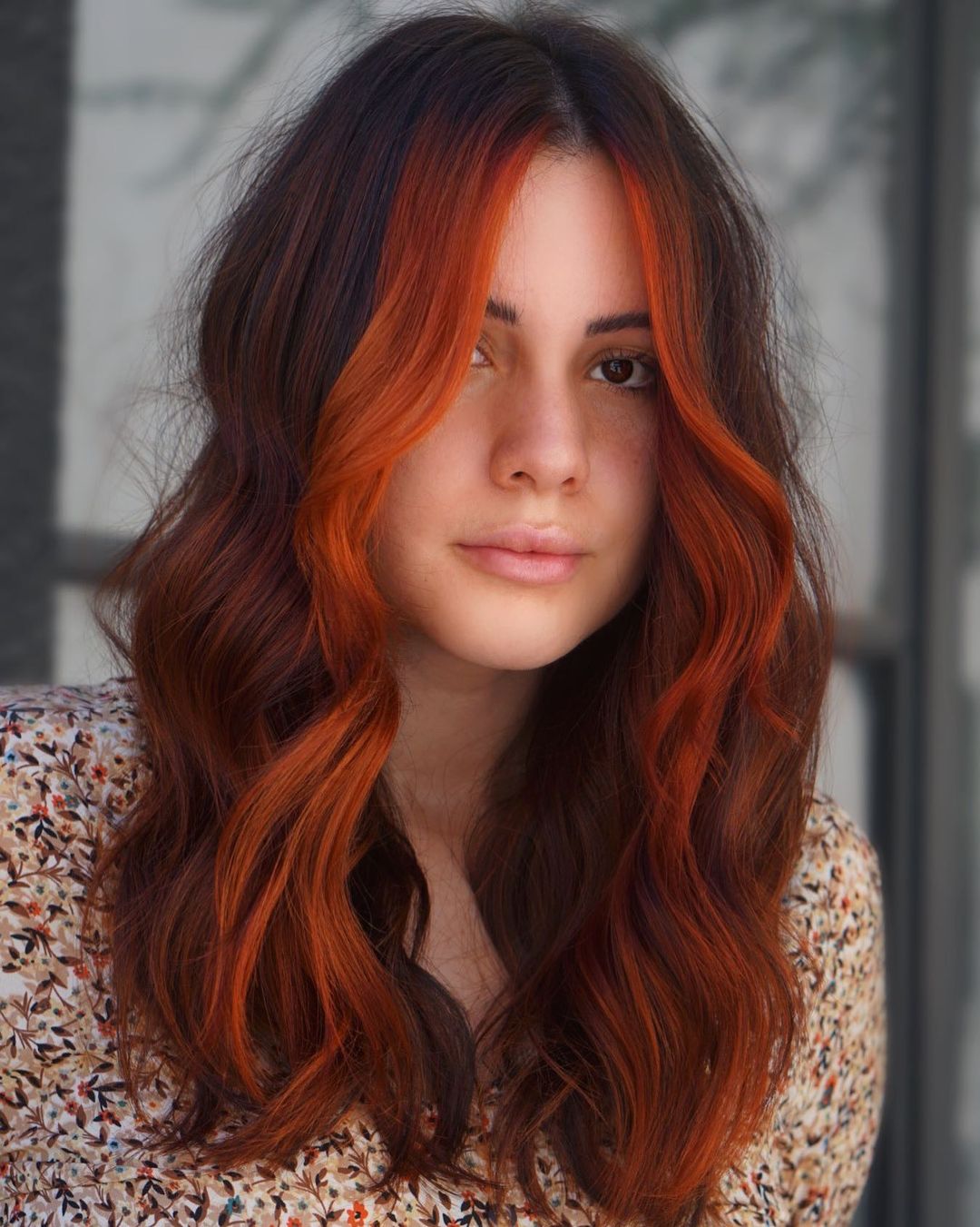Orange Money Piece on Long Dark Hair