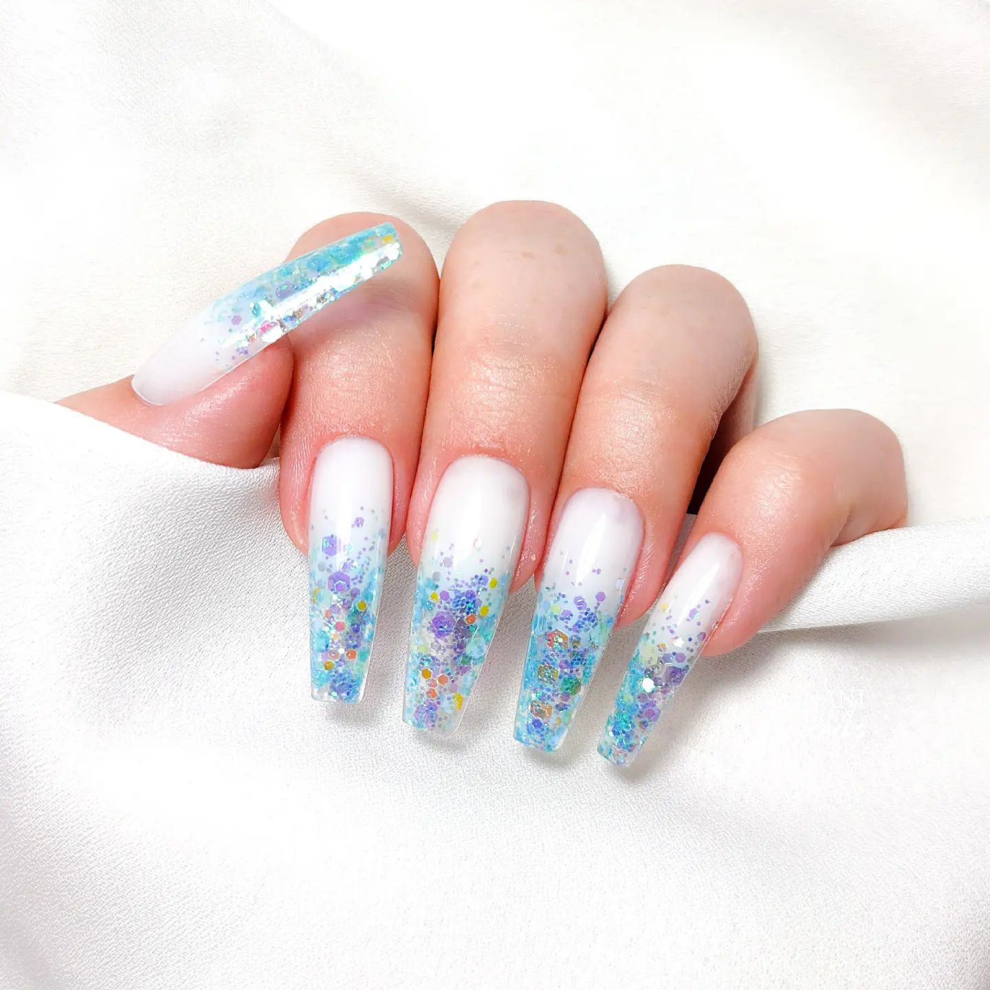 White Nails with Blue Glitter