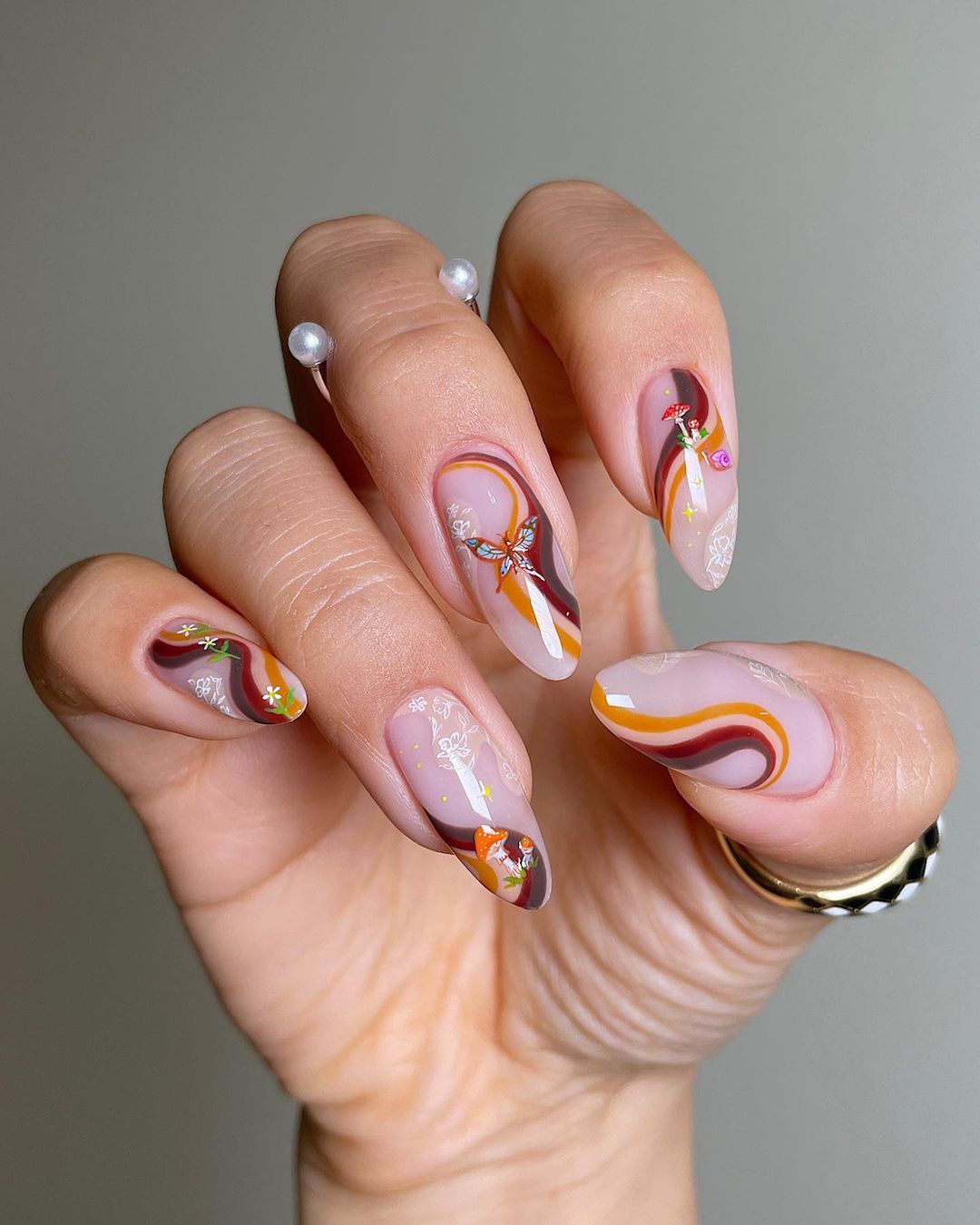 Acrylic Nails with Swirls and Butterfly Design