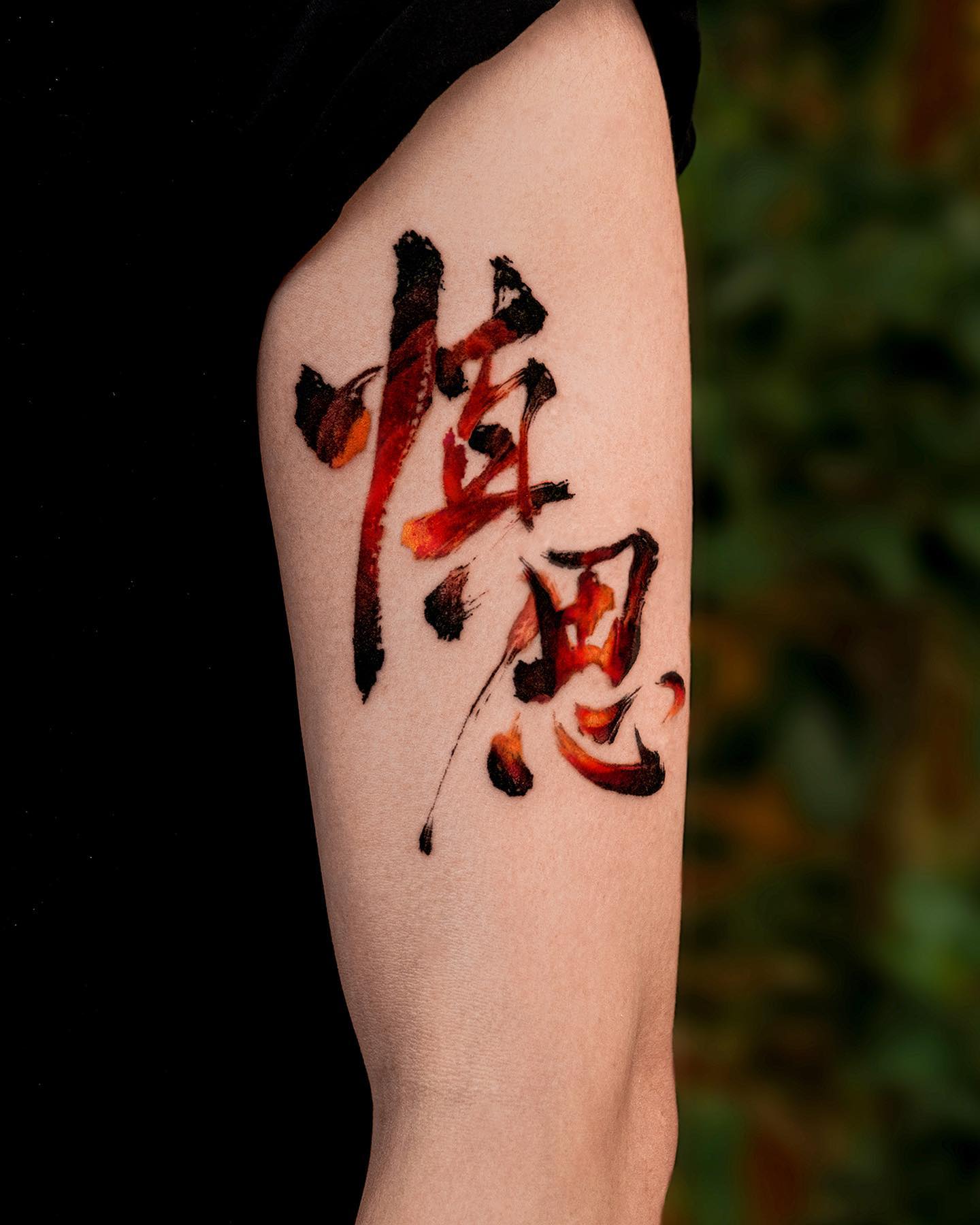 Black and Red Chinese Letters Tattoo